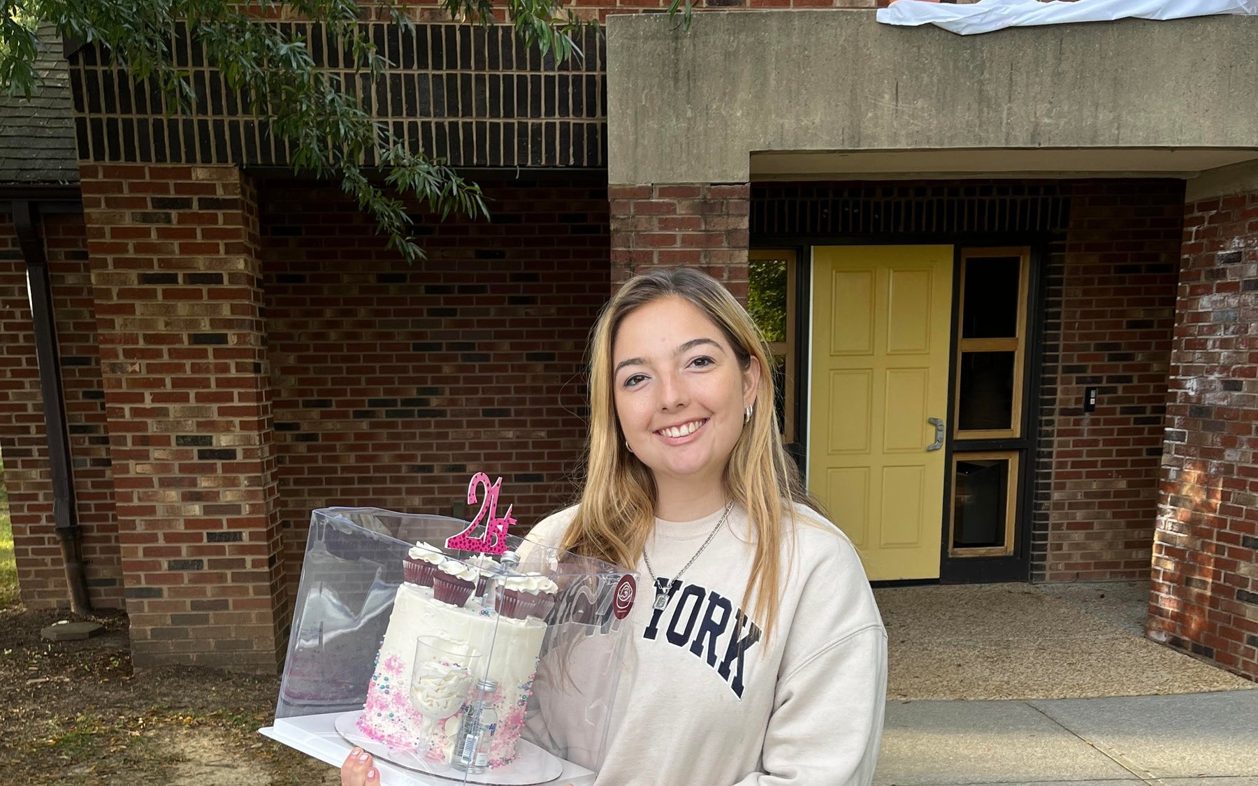Virginia Tech students receiving a celebration cake on campus